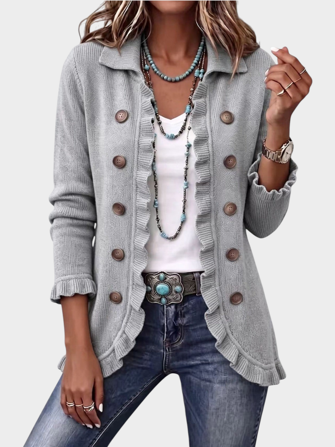 Zane & Inese grey ribbed knit cardigan with double-breasted buttons, ruffled trim, collar, and front pockets.