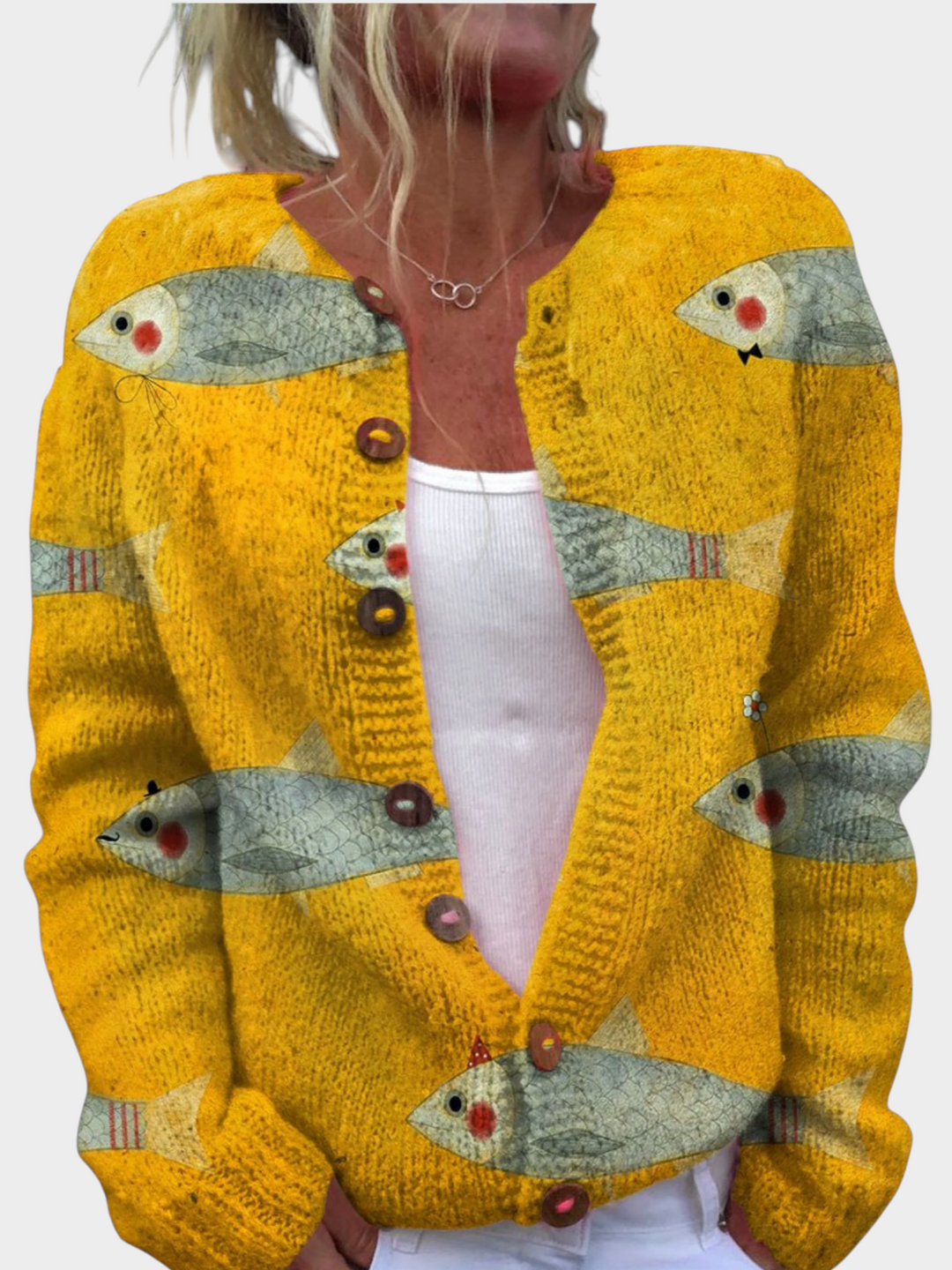 Zane & Inese golden yellow knit cardigan featuring a whimsical fish pattern and decorative round buttons