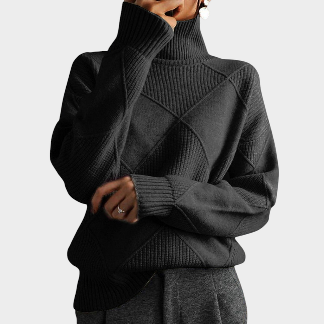 Zane & Inese Gaida charcoal grey turtleneck sweater with a geometric knit pattern and ribbed cuffs