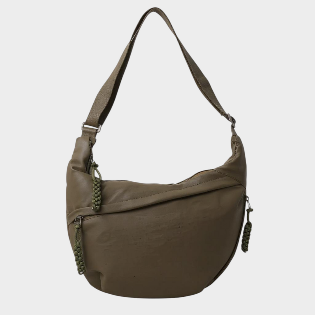 Zane & Inese Serafīna olive green crescent-shaped nylon shoulder bag with adjustable strap and zipper pulls