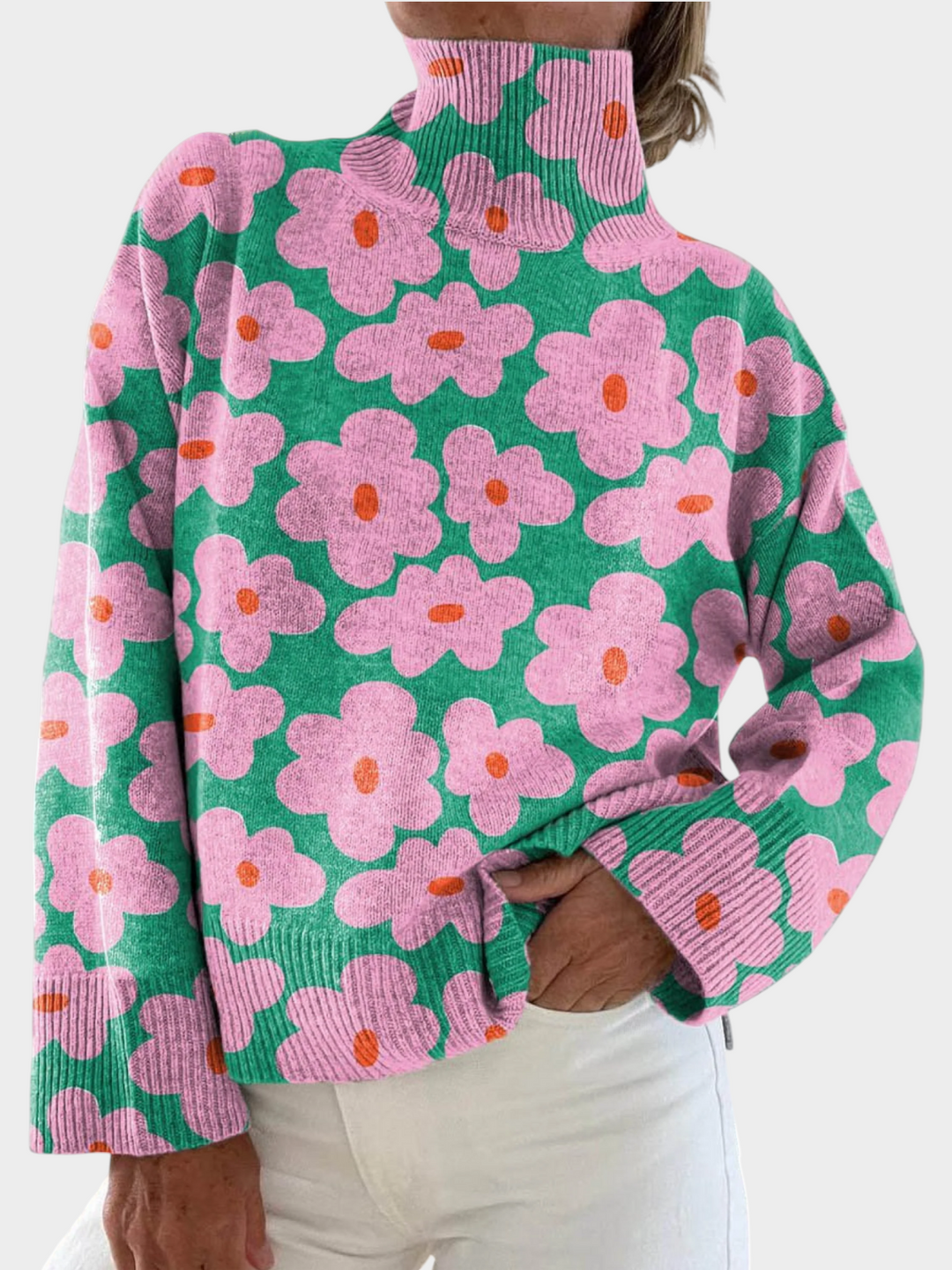Zane & Inese Aneteja green knit sweater with pink floral pattern, high neck, and ribbed cuffs in a relaxed fit.