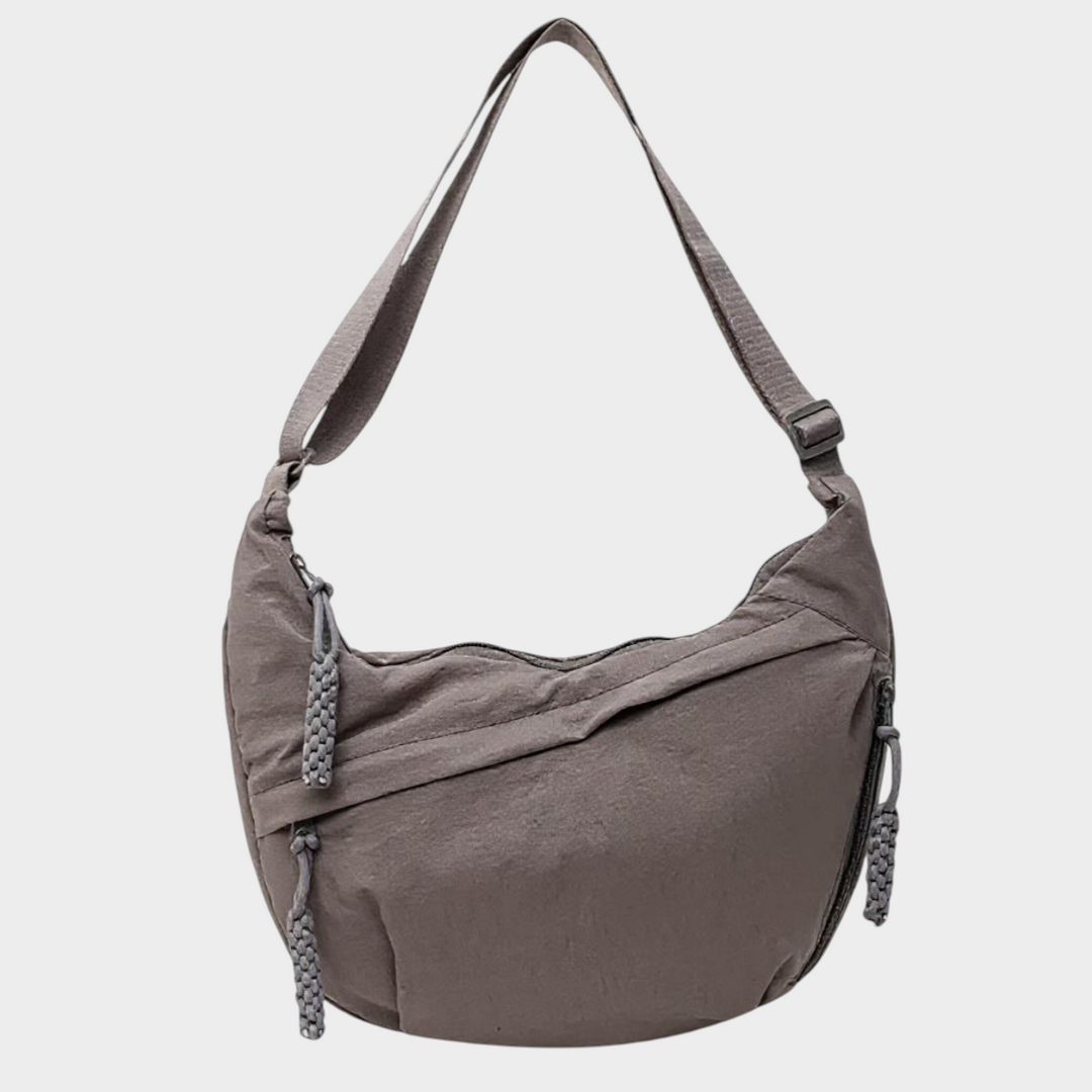 Zane & Inese Serafīna grey nylon crescent shoulder bag with adjustable strap and zippered compartments