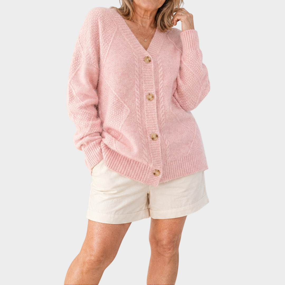 Zane & Inese Pauline soft pink knitted cardigan with V-neck, button-down front, and ribbed cuffs on a model