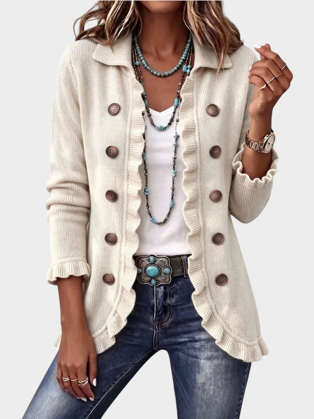 Zane & Inese ivory ribbed knit cardigan featuring double-breasted buttons, ruffled trim, and a classic collar.