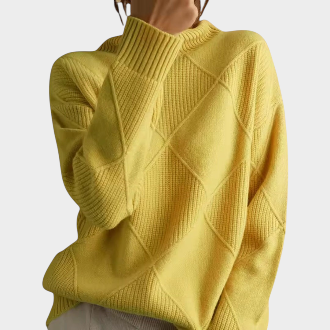 Zane & Inese yellow knit sweater with a high collar and geometric diamond pattern for a cozy, elegant look.
