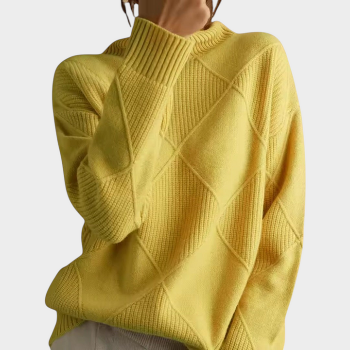 Zane & Inese yellow knit sweater with a high collar and geometric diamond pattern for a cozy, elegant look.
