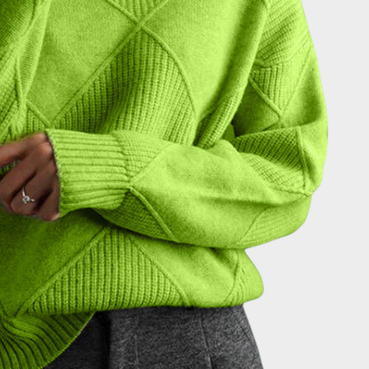 Zane & Inese lime green high-neck sweater with a geometric knit pattern, worn by a woman.