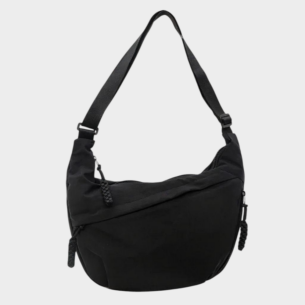 Zane & Inese Serafīna black nylon crescent shoulder bag with adjustable strap and zippered compartments