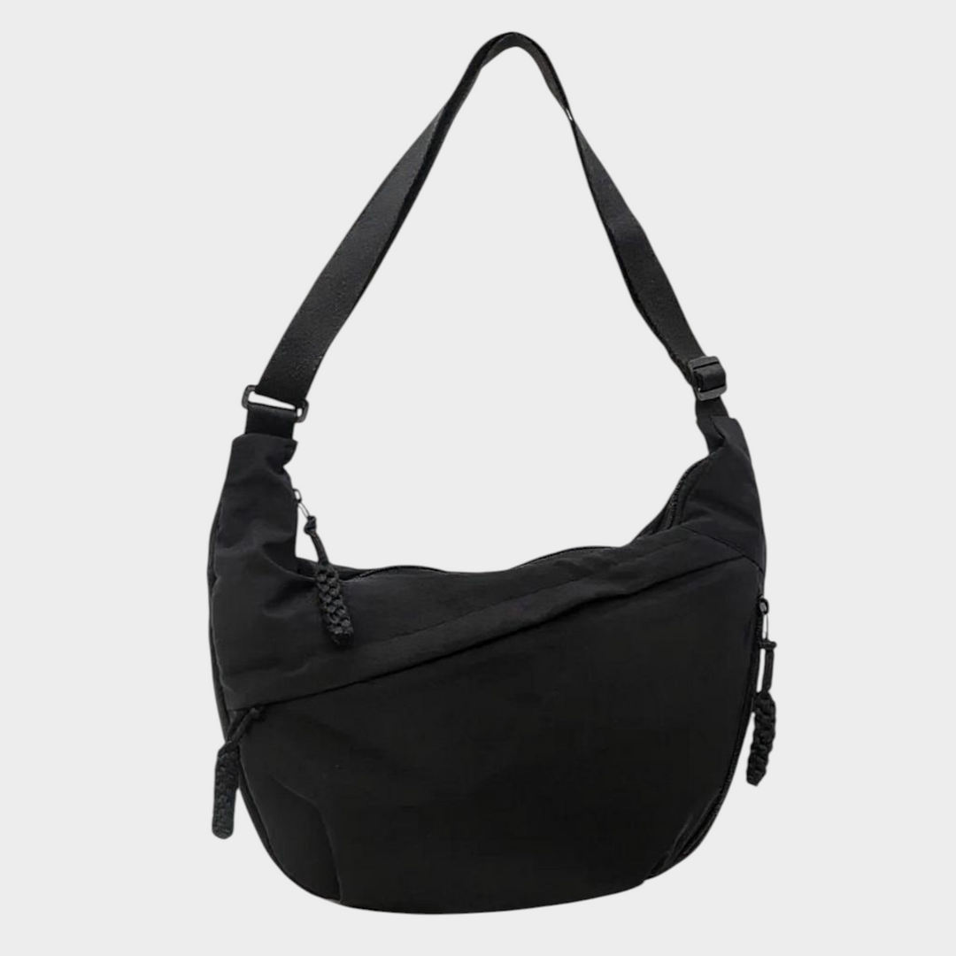 Zane & Inese Serafīna black nylon crescent shoulder bag with adjustable strap and zippered compartments