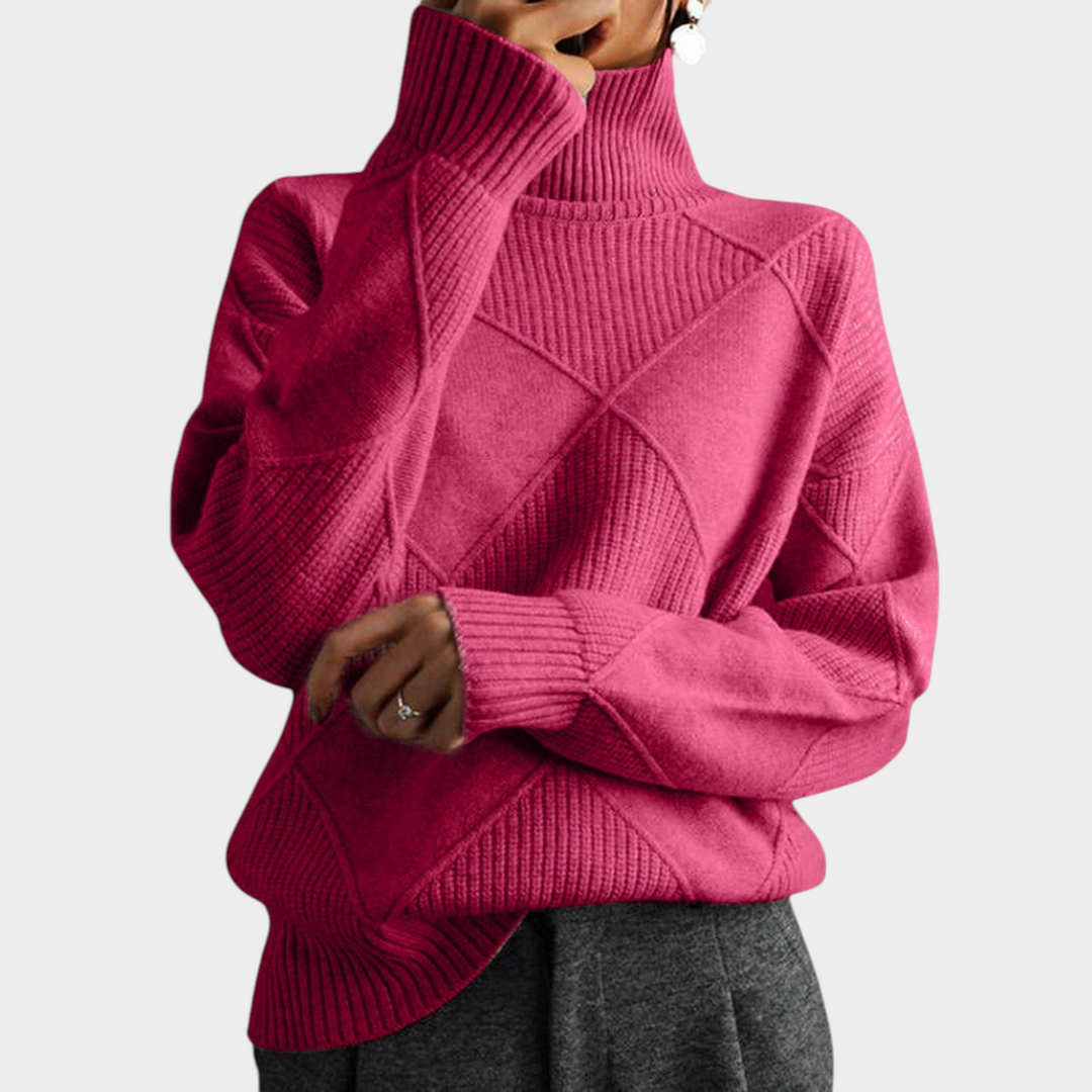 Zane & Inese pink turtleneck sweater featuring a geometric knit pattern and ribbed collar for a cozy elegant look.