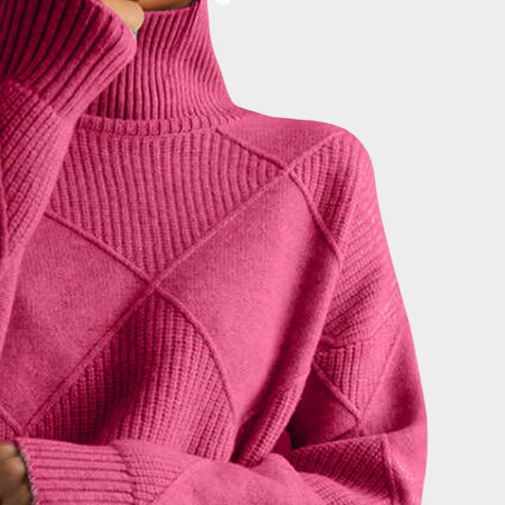 Zane & Inese Gaida pink turtleneck sweater featuring a soft knit texture and a modern geometric pattern.
