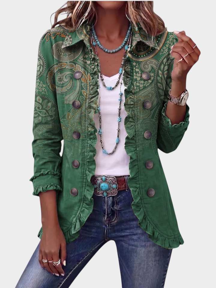Zane & Inese green paisley print boho jacket with feminine ruffle trim and button-up front worn with blue jeans