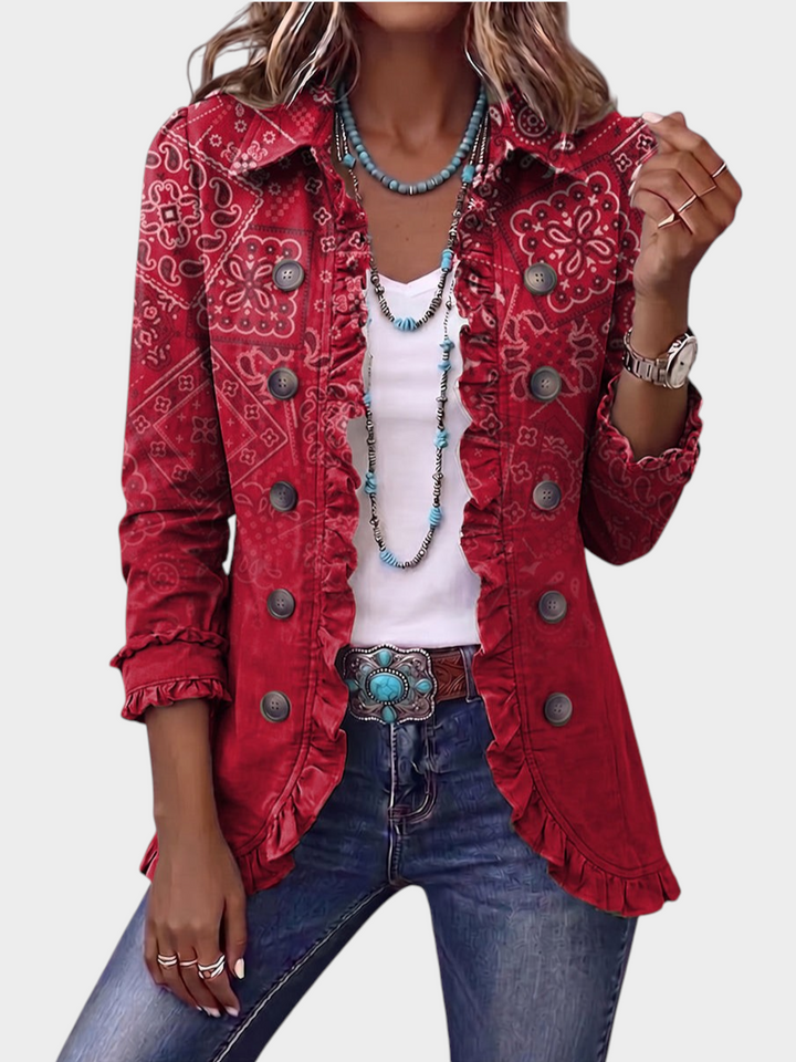 Zane & Inese red boho paisley print jacket with ruffled trim, vintage buttons, and a relaxed fit worn with jeans.