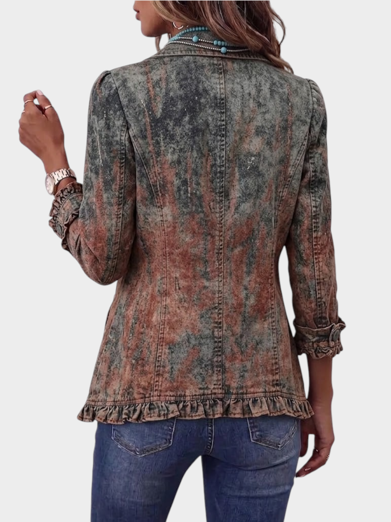 Zane & Inese Janina vintage style jacket with gradient texture, ruffled hem, and collar, worn with blue jeans.