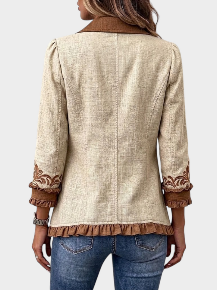 Zane & Inese Renate vintage boho jacket in beige with brown floral embroidery and ruffled hem, back view