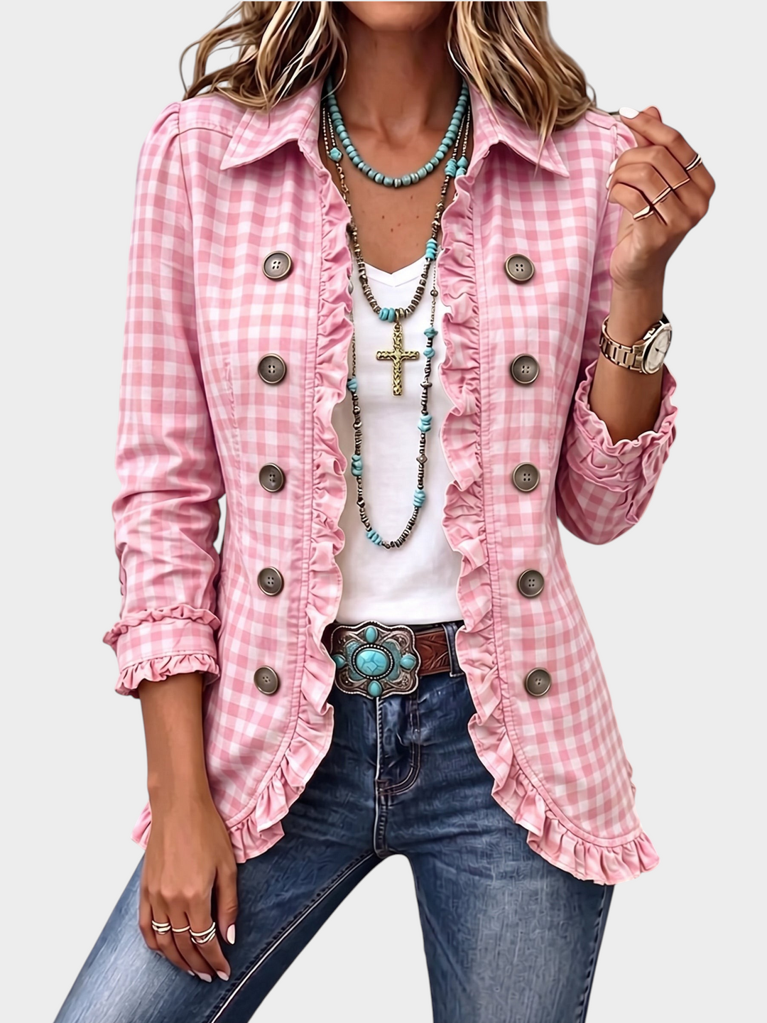 Zane & Inese pink gingham jacket with ruffled trim, double-breasted buttons, and long sleeves on a woman.